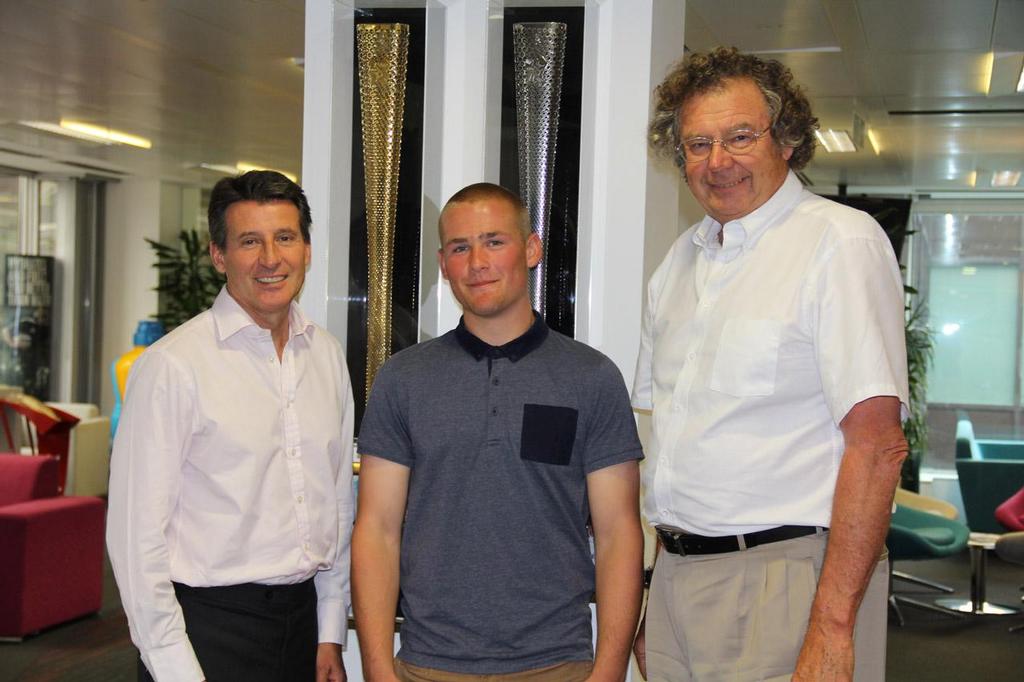 Lord Coe inspires Adam Greaves stood with Edward Leask and 2012 Olympic Torches ©  CSM